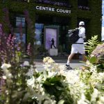 
              A man walks past the statue to former Wimbledon champion Fred Perry ahead of the Wimbledon tennis championships in London, Sunday, June 26, 2022. (AP Photo/Kirsty Wigglesworth)
            
