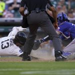 
              Detroit Tigers' Eric Haase (13) is tagged out at home plate by Texas Rangers catcher Jonah Heim (28) in the third inning of a baseball game in Detroit, Thursday, June 16, 2022. (AP Photo/Paul Sancya)
            