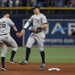 
              New York Yankees right fielder Aaron Judge, center, celebrates with second baseman DJ LeMahieu after the Yankees defeated the Tampa Bay Rays in a baseball game Wednesday, June 22, 2022, in St. Petersburg, Fla. (AP Photo/Scott Audette)
            