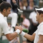 
              Serbia's Novak Djokovic greets Korea's Kwon Soonwoo at the net after winning their men's first round singles match on day one of the Wimbledon tennis championships in London, Monday, June 27, 2022. (AP Photo/Kirsty Wigglesworth)
            