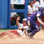 
              Oklahoma's Grace Lyons (3) slides into home ahead of the ball in the third inning of an NCAA softball Women's College World Series game against Northwestern on Thursday, June 2, 2022, in Oklahoma City. (AP Photo/Alonzo Adams)
            