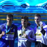 
              Mykhailo Romanchuk of Ukraine, Bobby Finke of the United States, Florian Wellbrock of Germany, from left to right, pose with their medals after the Men 800m Freestyle final at the 19th FINA World Championships in Budapest, Hungary, Tuesday, June 21, 2022. (AP Photo/Petr David Josek)
            