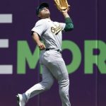 
              Oakland Athletics' Ramón Laureano makes a running catch to out Cleveland Guardians' Oscar Mercado during the second inning of a baseball game, Sunday, June 12, 2022, in Cleveland. (AP Photo/Ron Schwane)
            
