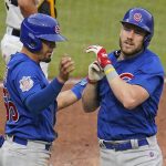 
              Chicago Cubs' Patrick Wisdom, right, is greeted by Rafael Ortega as he returns to the dugout after hitting a two-run home run off Pittsburgh Pirates starting pitcher Jerod Eickhoff during the fourth inning of a baseball game in Pittsburgh, Wednesday, June 22, 2022. (AP Photo/Gene J. Puskar)
            