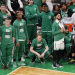 
              Boston Celtics players watch play from the sidelines during the fourth quarter of Game 6 of basketball's NBA Finals against the Golden State Warriors, Thursday, June 16, 2022, in Boston. (AP Photo/Michael Dwyer)
            