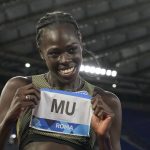 
              Athing Mu of the United States celebrates after winning the the women's 800-meter competition at the Golden Gala Pietro Mennea IAAF Diamond League athletics meeting in Rome, Thursday, June 9, 2022. (AP Photo/Andrew Medichini)
            