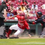 
              CORRECTS TO SUNDAY, JUNE 5, 2022, NOT SATURDAY, JUNE 4, 2022 Cincinnati Reds' Nick Senzel (15) slides safely into home plate against Washington Nationals catcher Keibert Ruiz (20) after a single hit by Tommy Pham during the first inning of a baseball game Sunday, June 5, 2022, in Cincinnati. (AP Photo/Jeff Dean)
            