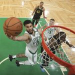 
              Boston Celtics forward Jayson Tatum (0) goes up for a shot against the Golden State Warriors during Game 3 of basketball's NBA Finals, Wednesday, June 8, 2022, in Boston. (Kyle Terada/Pool Photo via AP)
            