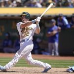 
              Oakland Athletics' Sean Murphy (12) hits a three-run home run in front of Kansas City Royals catcher Salvador Perez during the sixth inning of a baseball game in Oakland, Calif., Sunday, June 19, 2022. (AP Photo/Jeff Chiu)
            
