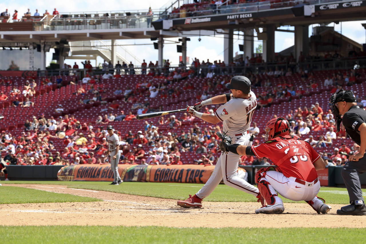 Arizona Diamondbacks' Josh Rojas hits a two-run single during the ninth inning of a baseball game a...