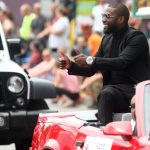 
              International Boxing Hall of Fame class of 2021 inductee Floyd Mayweather waves to paradegoers during the annual Parade of Champions on Sunday, June 12, 2022, in Canastota, N.Y. (John Haeger/Standard-Speaker via AP)
            