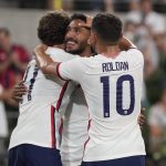 
              U.S. forward Jesus Ferriera (9), center, celebrates his fourth goal against Grenada with Cristian Roldan (10) and Brenden Aaronson (11) during the second half of a CONCACAF Nations League soccer match in Austin, Texas, Friday, June 10, 2022. (AP Photo/Chuck Burton)
            