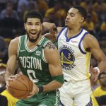 
              Boston Celtics forward Jayson Tatum (0) drives to the basket against Golden State Warriors guard Jordan Poole (3) during the first half of Game 1 of basketball's NBA Finals in San Francisco, Thursday, June 2, 2022. (AP Photo/Jed Jacobsohn)
            