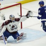 
              Colorado Avalanche goaltender Darcy Kuemper makes a save on a shot from Tampa Bay Lightning left wing Ondrej Palat during the first period of Game 3 of an NHL hockey Stanley Cup Final on Monday, June 20, 2022, in Tampa, Fla. (AP Photo/Chris O'Meara)
            