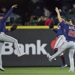 
              Minnesota Twins outfielders, Trevor Larnach (13), Gilberto Celestino (67) and Max Kepler (26) celebrate their 3-2 win over the Seattle Mariners in a baseball game, Monday, June 13, 2022, in Seattle. (AP Photo/John Froschauer)
            