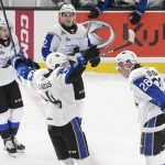 
              Saint John Sea Dogs' William Dufour, right, celebrates his goal against the Edmonton Oil Kings with Philippe Daoust, Ryan Francis and Yan Kuzentsov, from left, during the first period of a Memorial Cup hockey game Wednesday, June 22, 2022, in Saint John, New Brunswick. (Darren Calabrese/The Canadian Press via AP)
            