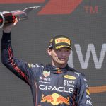 
              Red Bull Racing's Max Verstappen, of the Netherlands, celebrates after winning the Canadian Grand Prix auto race Sunday, June 19, 2022, in Montreal. (Paul Chiasson/The Canadian Press via AP)
            