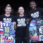 
              Seattle Storm guard Sue Bird, center, poses for a photo with former Storm teammates, New York Liberty forward Natasha Howard, left, and guard Sami Whitcomb during a presentation before a WNBA basketball game between the Liberty and the Storm, Sunday, June 19, 2022, in New York. (AP Photo/Mary Altaffer)
            