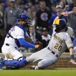 
              Chicago Cubs catcher Willson Contreras tries to tag out Milwaukee Brewers' Mike Brosseau at home during the fifth inning of a baseball game Wednesday, June 1, 2022, in Chicago. After video review, Brosseau was called safe. (AP Photo/Charles Rex Arbogast)
            