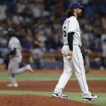 
              Tampa Bay Rays pitcher Ralph Garza Jr. walks on the mound after giving up a two-run home run to New York Yankees' Jose Trevino, left, during the eighth inning of a baseball game Wednesday, June 22, 2022, in St. Petersburg, Fla. (AP Photo/Scott Audette)
            