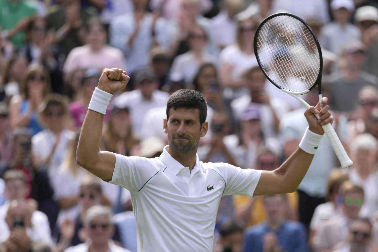 Serbia's Novak Djokovic celebrates defeating Australia's Thanasi Kokkinakis in a singles tennis mat...