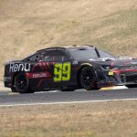 
              Eventual winner Daniel Suarez (99) leads the pack through Turn 3 during a NASCAR Cup Series auto race, Sunday, June 12, 2022, at Sonoma Raceway in Sonoma, Calif. (AP Photo/D. Ross Cameron)
            