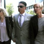 
              Former USC women's soccer coach Ali Khosroshahin, center, arrives at federal court, Thursday, June 27, 2019, to face charges in a nationwide college admissions bribery scandal, in Boston. Khosroshahin, who took bribes in exchange for helping unqualified kids get into USC, was sentenced Wednesday June 29, 2022, to six months in home confinement after cooperating with authorities investigating the sprawling college admissions scandal. (AP Photo/Charles Krupa, File)
            