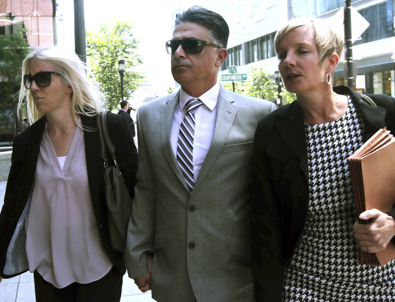 Former USC women's soccer coach Ali Khosroshahin, center, arrives at federal court, Thursday, June ...