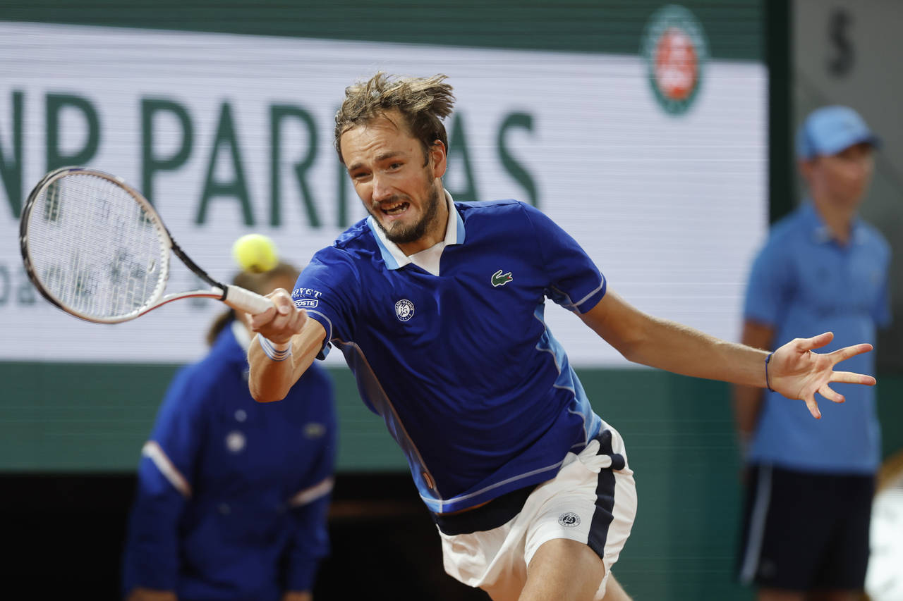 Russia's Daniil Medvedev returns the ball to Croatia's Marin Cilic during their fourth round match ...