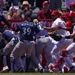 
              Several members of the Seattle Mariners and the Los Angeles Angels scuffle after Mariners' Jesse Winker was hit by a pitch during the second inning of a baseball game Sunday, June 26, 2022, in Anaheim, Calif. (AP Photo/Mark J. Terrill)
            