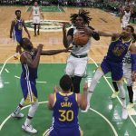 
              Boston Celtics center Robert Williams III (44) is stripped of the ball by Golden State Warriors forward Otto Porter Jr. (32) during the third quarter of Game 6 of basketball's NBA Finals, Thursday, June 16, 2022, in Boston. (Elsa/Pool Photo via AP)
            