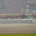 
              The Cincinnati Reds grounds crew rolls out a tarp as play is suspended due to rain during the seventh inning of a baseball game against the Arizona Diamondbacks, Monday, June 6, 2022, in Cincinnati. (AP Photo/Jeff Dean)
            