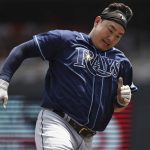 
              Tampa Bay Rays' Ji-Man Choi runs toward home base after Yandy Diaz hit a single during the first inning of a baseball game against the Minnesota Twins, Saturday, June 11, 2022, in Minneapolis. (AP Photo/Stacy Bengs)
            