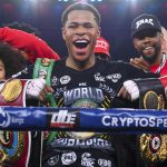 
              Devin Haney, center, of the United States, poses with his belts after defeating Australia's George Kambosos in their WBC lightweight title fight in Melbourne, Australia, Sunday, June 5, 2022. Haney retained his WBC lightweight title and added three more from the weight class with a unanimous points decision over Australian George Kambosos. (James Ross/AAPImage via AP)
            