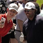 
              Phil Mickelson poses for a photo with a fan during a practice round ahead of the U.S. Open golf tournament, Tuesday, June 14, 2022, at The Country Club in Brookline, Mass. (AP Photo/Charlie Riedel)
            