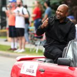 
              International Boxing Hall of Fame class of 2022 inductee Roy Jones Jr. waves to paradegoers during the annual Parade of Champions on Sunday, June 12, 2022, in Canastota, N.Y. (John Haeger/Standard-Speaker via AP)
            