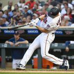
              Minnesota Twins' Alex Kirilloff hits a double, driving in two runs, against the Colorado Rockies during the seventh inning of a baseball game, Saturday, June 25, 2022, in Minneapolis. Kyle Garlick and Max Kepler scored. (AP Photo/Craig Lassig)
            