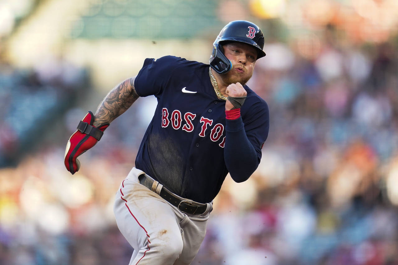 Boston Red Sox' Christian Vazquez (7) runs to third during the second inning of a baseball game aga...