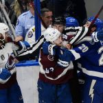 
              Linesman Ryan Daisy separates Colorado Avalanche defenseman Josh Manson (42) and Tampa Bay Lightning left wing Nicholas Paul (20) during the first period of Game 6 of the NHL hockey Stanley Cup Finals on Sunday, June 26, 2022, in Tampa, Fla. (AP Photo/John Bazemore)
            