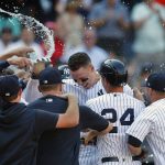 
              New York Yankees right fielder Aaron Judge (99) celebrates with teammates after his walk-off home run against the Houston Astros during the tenth inning of a baseball game, Sunday, June 26, 2022, in New York. The New York Yankees won 6-3. (AP Photo/Noah K. Murray)
            