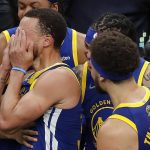 
              Golden State Warriors guard Stephen Curry reacts after the Warriors defeated the Boston Celtics in Game 6 of basketball's NBA Finals, Thursday, June 16, 2022, in Boston. (AP Photo/Michael Dwyer)
            