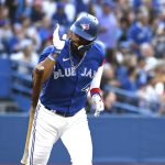 
              Toronto Blue Jays' Teoscar Hernandez drops his bat after hitting a two-run double against the Boston Red Sox during the first inning of a baseball game Tuesday, June 28, 2022, in Toronto. (Jon Blacker/The Canadian Press via AP)
            