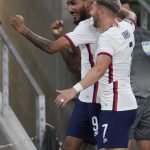 
              U.S. forward Jesus Ferriera (9) is congratulated by forward Paul Arriola (7) after a goal against Grenada during the second half of a CONCACAF Nations League soccer match in Austin, Texas, Friday, June 10, 2022. (AP Photo/Chuck Burton)
            