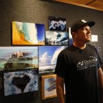 
              Clark Little, a wave photographer from the North Shore of Oahu, speaks during an interview at his gallery in Haleiwa, Hawaii, Friday, May 13, 2022. (AP Photo/Caleb Jones)
            