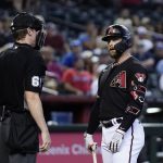 
              Arizona Diamondbacks' Christian Walker, right, stares at umpire Alex Tosi after being called out on strikes during the third inning of a baseball game against the Atlanta Braves Wednesday, June 1, 2022, in Phoenix. (AP Photo/Ross D. Franklin)
            