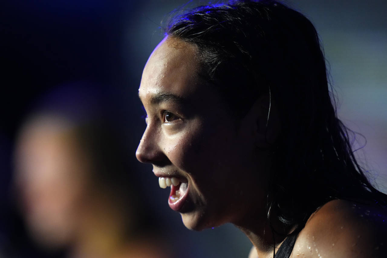 Torri Huske of the United States reacts after winning the Women 100m Butterfly final at the 19th FI...