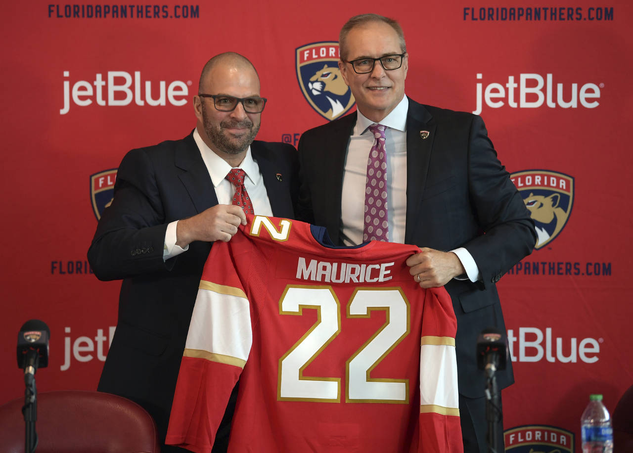 Paul Maurice, right, is introduced as the new head coach of the Florida Panthers by general manager...