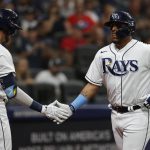 
              Tampa Bay Rays' Isaac Paredes, right, celebrates with Josh Lowe after hitting a home run against the New York Yankees during the second inning of a baseball game Wednesday, June 22, 2022, in St. Petersburg, Fla. (AP Photo/Scott Audette)
            