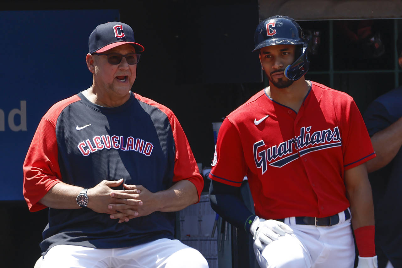 Cleveland Guardians manager Terry Francona, left, talks with Oscar Mercado during the eighth inning...