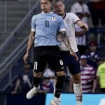 
              Uruguay forward Darwin Nunez (11) and USA defender Walker Zimmerman, right, battle for the ball during the second half of an international friendly soccer match Sunday, June 5, 2022, in Kansas City, Kan. The match ended in a 0-0 tie. (AP Photo/Charlie Riedel)
            